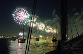 Fireworks in the sky from the decks of Schooner Adirondack III for the Winthrope Fireworks Cruise with Classic Harbor Line