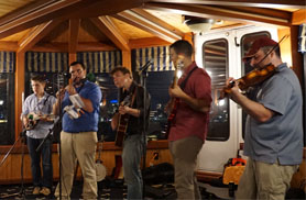 a 5 person Boston Irish Band playing music aboard the yacht Northern Lights for a Boston Harbor Music Cruise